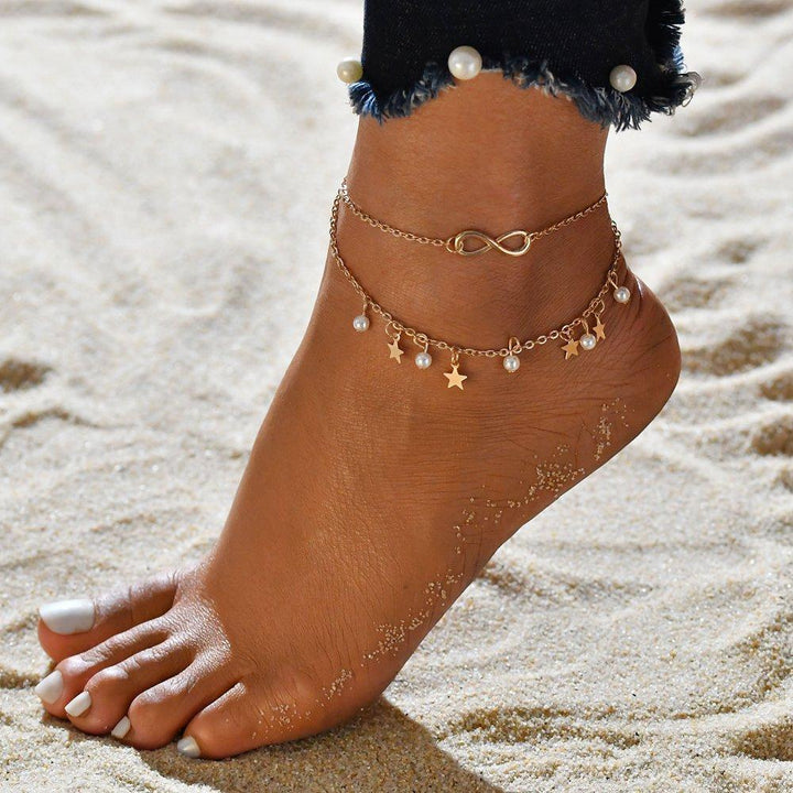 Bracciale elegante con motivo infinito con perle e stelle - accessorio eccezionale per tutte le occasioni